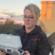 Licensed drone pilot setting up to begin crisis response mis